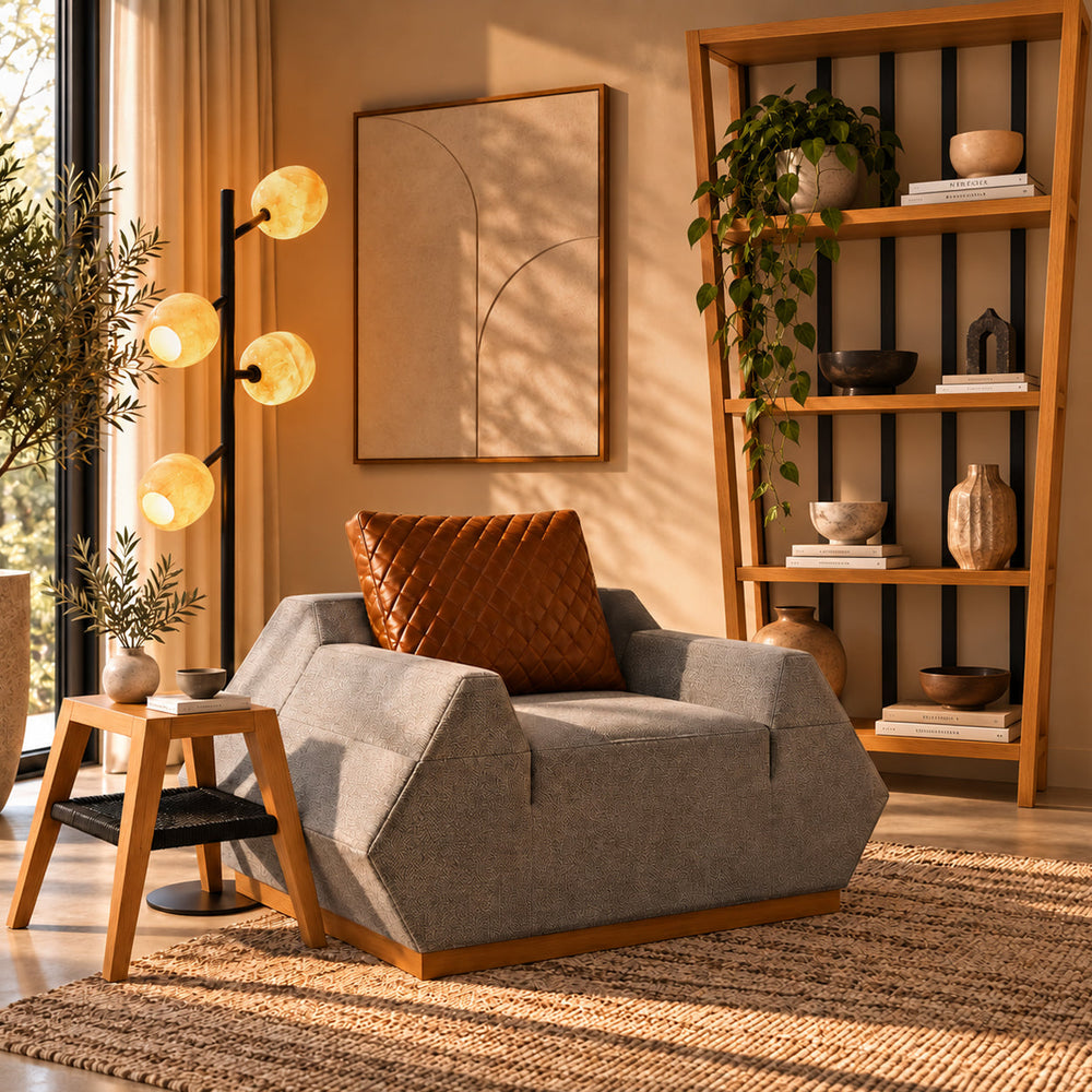 Sunlit reading corner with gray and havane Pyra armchair, oak side table and shelving, and a four-globe Tree floor lamp