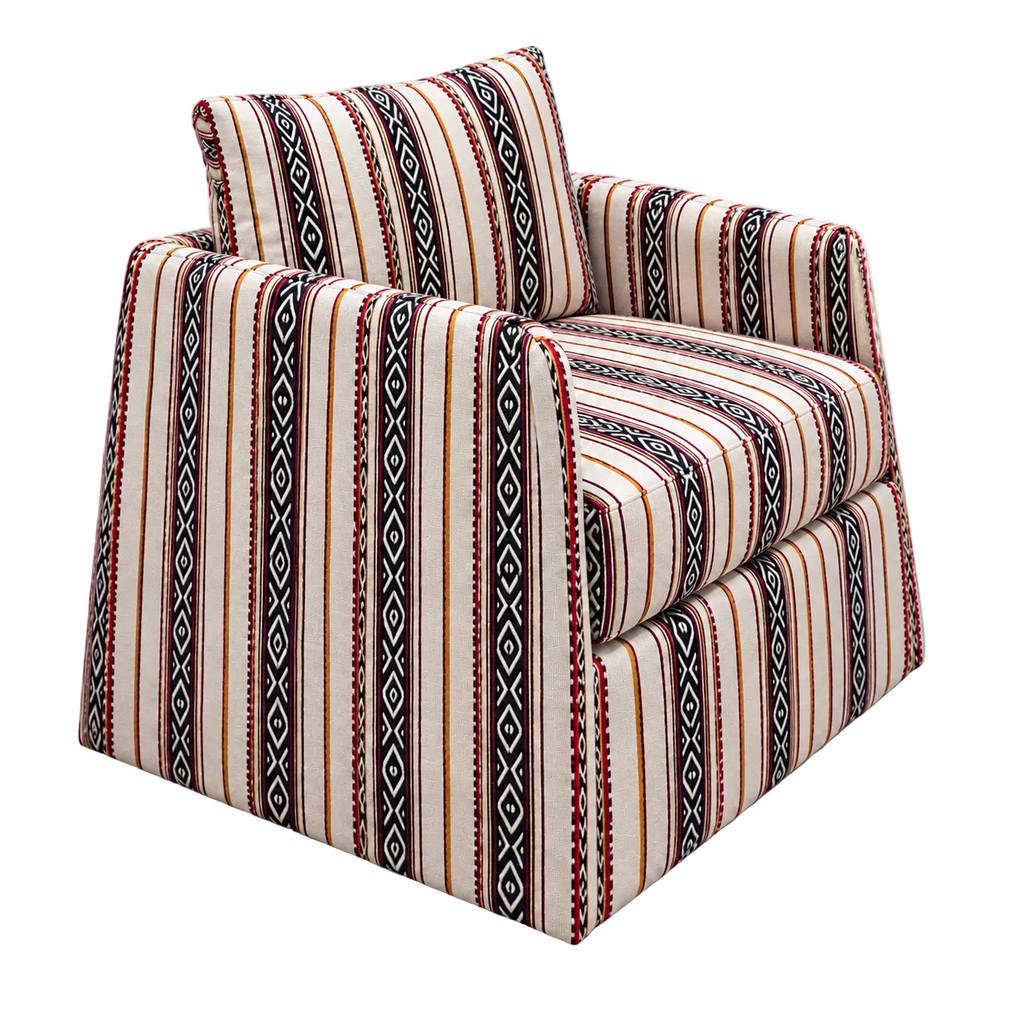 Nomad Armchair with cream upholstery, black geometric stripes and red accents